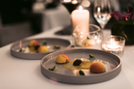 Two beautifully arranged plates with dessert in an upscale restaurant in Munich.