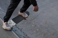 A man practices skating in a bowl at a Munich skate park.