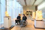 Two young wheelchair users visit a museum in Munich.