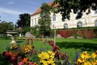 Park with summer flowers in front of Dachau Castle.