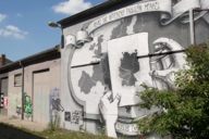 A large mural on a house wall in the creative quarter on Dachauer Straße