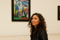 A woman in the exhibition "Der Blaue Reiter" in the Lenbachhaus in Munich