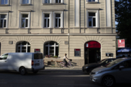 Young woman riding her bike in the sun in Munich.