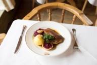 A plate with roast duck at Spatenhaus in Munich