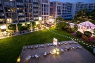 The inner courtyard of the Pullman Munich Hotel in the evening.