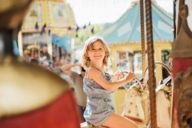 A girl on a carousel at the Auer Dult in Munich.