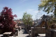 A roof terrace with lots of wood and plants in Munich.