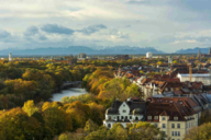 The Isar in Munich in autumn with a view of the Alps