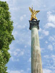 Friedensengel in Munich under a blue sky.