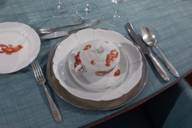 Porcelain with lobster motif on a set table