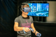 A young man takes part in a VR experience in the Jochen Schweizer Arena.