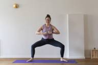 Munich yoga teacher Sandra Zavaglia in the "Wiesnbedienung" yoga pose