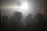 Several people dance in the fog of the club Unterdeck in Munich.