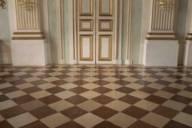 Light and red limestone in a check pattern form the wonderful floor in the Stone Hall, Nymphenburg Palace.