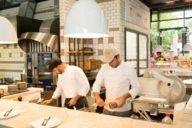 Cooks in the Eataly shop and restaurant in Munich preparing food.