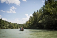 A woman and a man in a canoe on the Isar River.