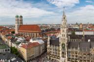 Panoramic view of the Neues Rathaus in Munich with the Frauenkirche in the background.