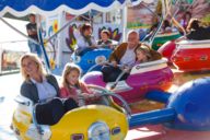 A woman with a girl in the Calypso ride on the Oidn Wiesn in Munich