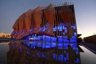 The spectacular exterior façade of the Showpalast in Munich in the evening.