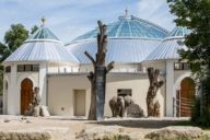 Exterior view of the elephant house with two elephants at Munich Zoo Hellabrunn.