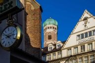 Pedestrian zone in Munich with one of the two towers of the Frauenkirche in Munich.