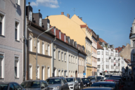 Various house facades in the sunlight in Munich.