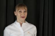 The star chef Nathalie Leblond in portrait with her white chef's jacket on