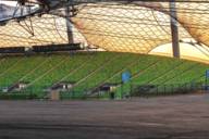 View of the interior of the Olympic Stadium in Munich at sunset.
