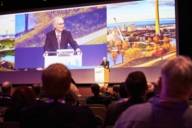 Opening speech by Prof. Lackner, standing at the lectern