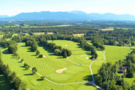 Golf course in the open nature with trees