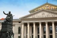 View of the Bayerische Staatsoper and Nationaltheater at Max-Joseph-Platz in Munich with the statue of King Max I. Joseph in the front.