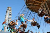 Oktoberfest visitors in a chain carousel in Munich