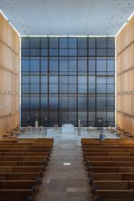 The modern Sacred Heart Church with altar and wooden benches