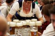 A waitress is serving beer at the Oktoberfest in Munich.