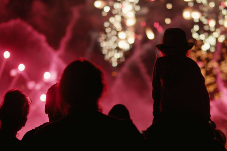 People watching a sparkling fireworks display in Munich