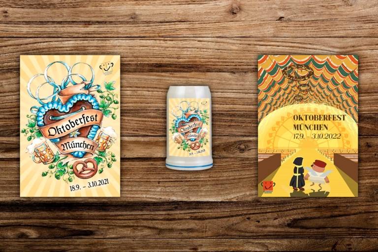 The Oktoberfest posters 2022 and 2021 and the Oktoberfest mug 2021 on a wooden wall