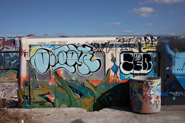 A disused underground car full of graffiti stands in the Schlachthof district