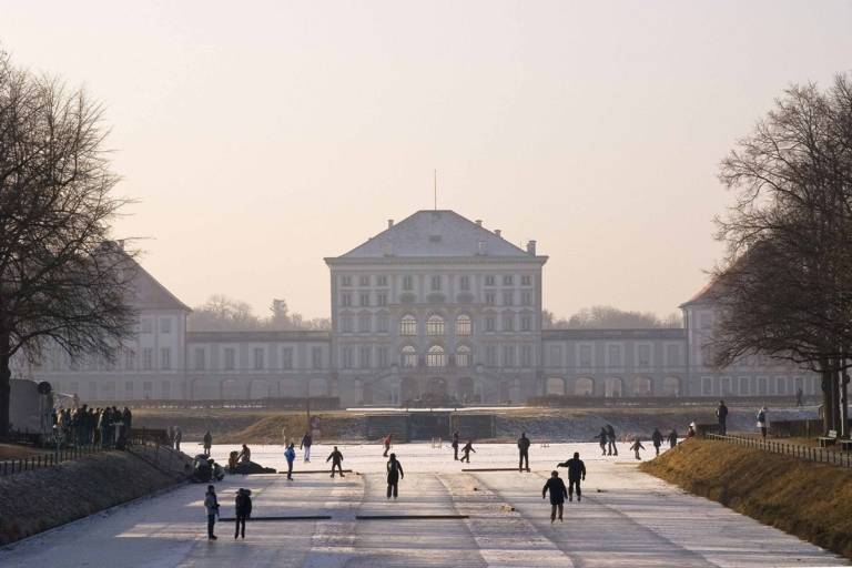 Ice curling rink on the canal in front of Nymphenburg Palace in Munich in winter.