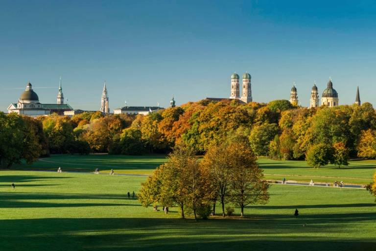 The Englischer Garten in Munich with the skyline of the inner city.