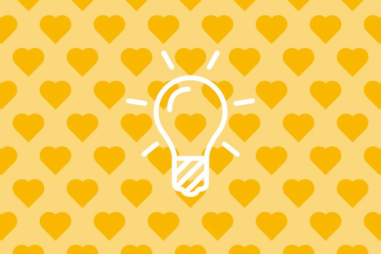 Light bulb on yellow background