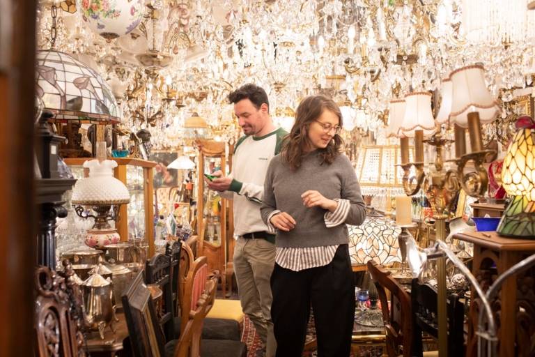 A man and a woman in an antique shop in Munich