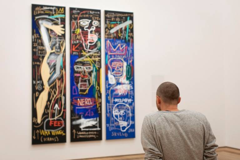 A man looks at a work of art in the Museum Brandhorst in Munich