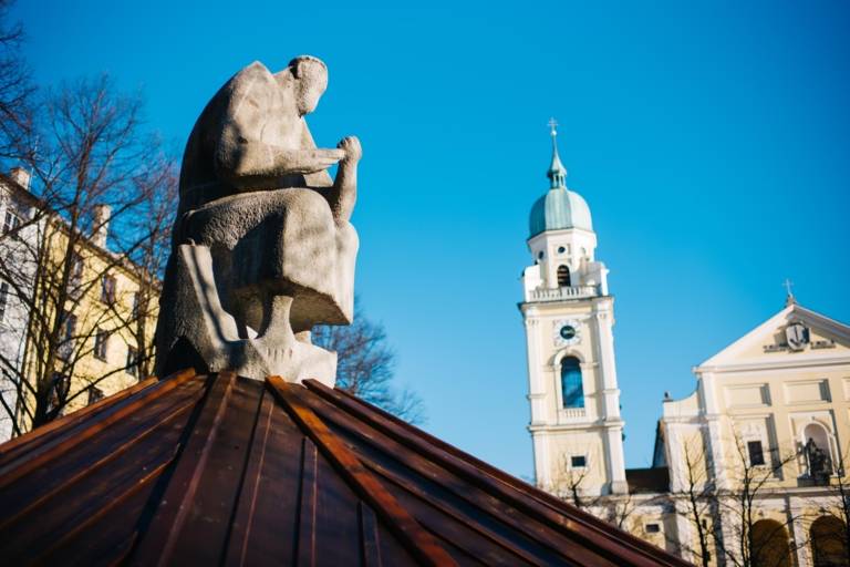 A statue and a church at Josephsplatz in the Maxvorstadt in Munich