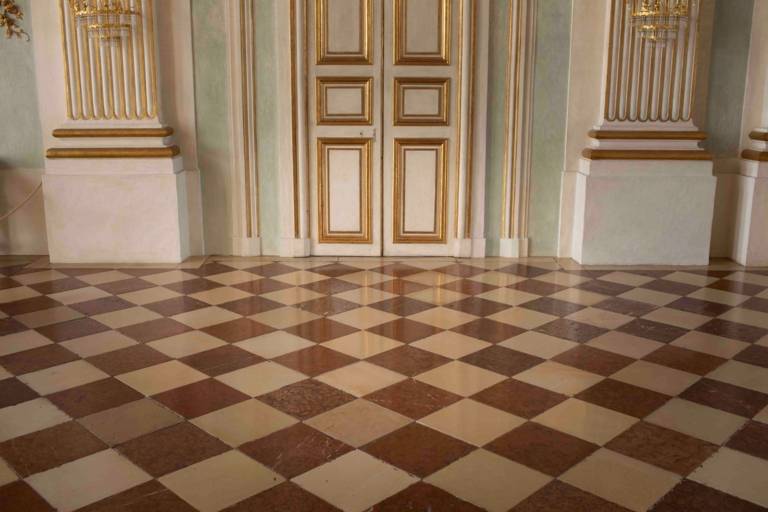 Light and red limestone in a check pattern form the wonderful floor in the Stone Hall, Nymphenburg Palace.