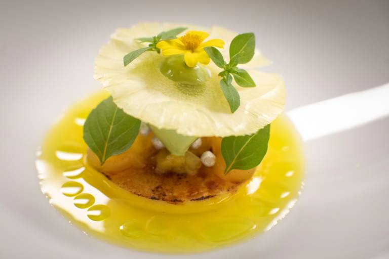 A close-up of a dessert with pineapple at the Atelier restaurant