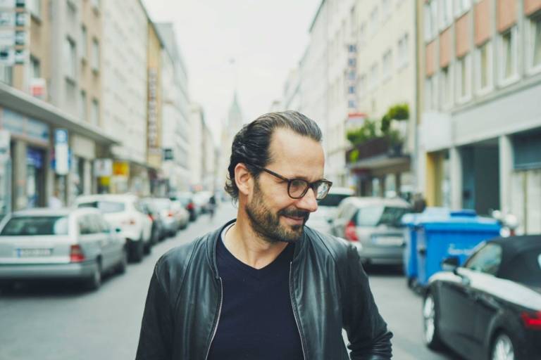 Portrait of the industrial designer Konstantin Grcic on a street in Munich.