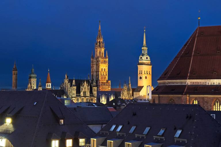 Munich city centre with the church towers and the New Town Hall in the evening.