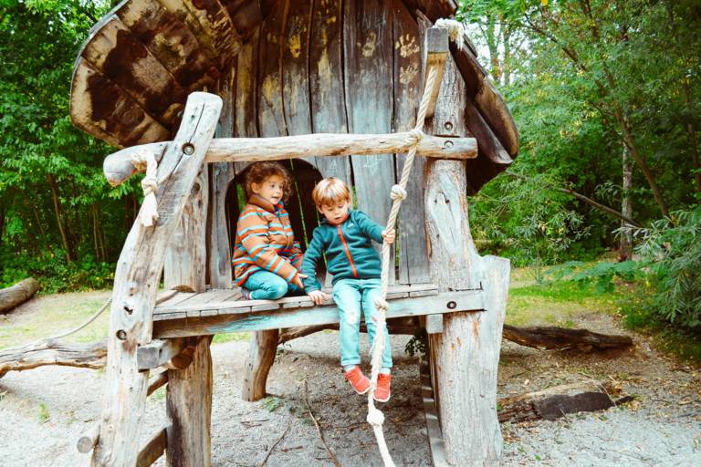 Two children are in a playground in Munich.