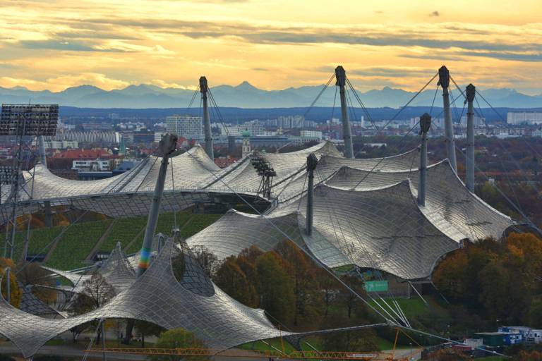 The Olympic tent roof in Munich against the backdrop of the Alps