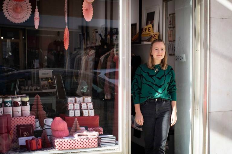 Stephanie Zürn standing in the door of her store Capricorn Store in Munich.